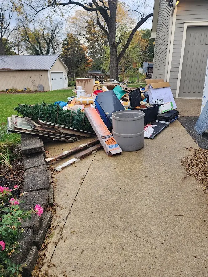 Dumpster being loaded with debris for 10 Yard Dumpster Rental in Claymont